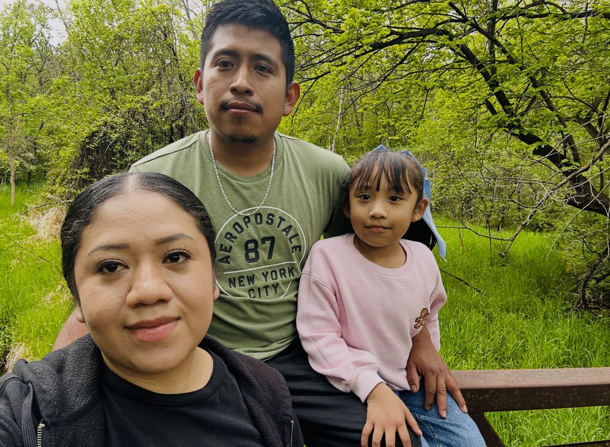Huriel Cardona Chiman, the painter behind Carolina Painting, with his wife and daughter
